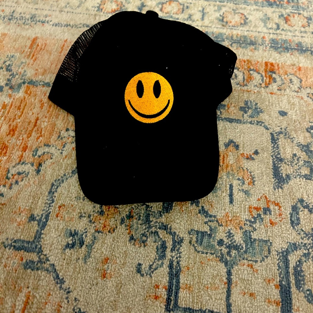 black smiley face hat